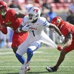 Southern Methodist Mustangs running back Brashard Smith (1) runs the ball against Louisville Cardinals defensive back Tamarion McDonald (12) during the second half at L&N Federal Credit Union Stadium